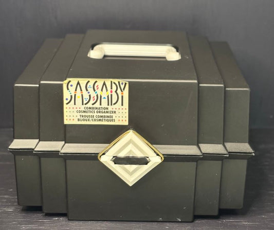 Green cosmetic organizer with a gold label on a dark background