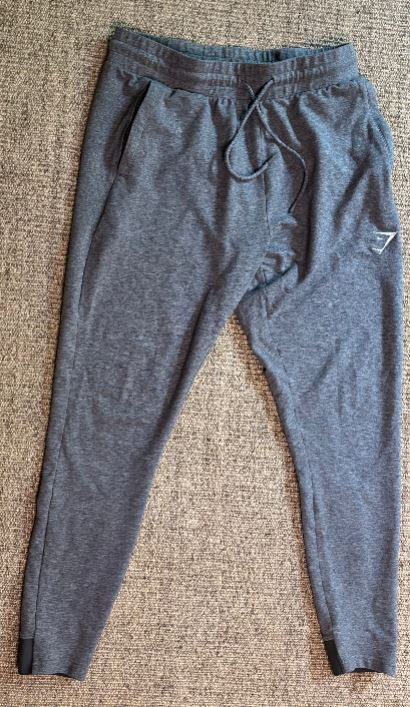 Gray sweatpants on a textured surface