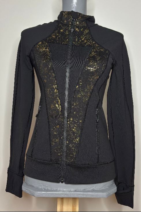 Black jacket with gold detailing on a mannequin against a white background
