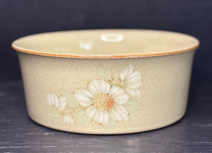 Ceramic bowl with floral design on a dark background