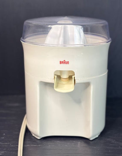 Braun kitchen appliance on a dark surface