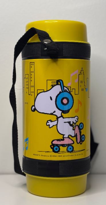 Yellow thermos with Snoopy design on a white background