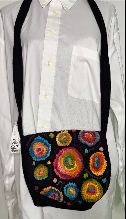 Colorful handbag with floral patterns on a white shirt