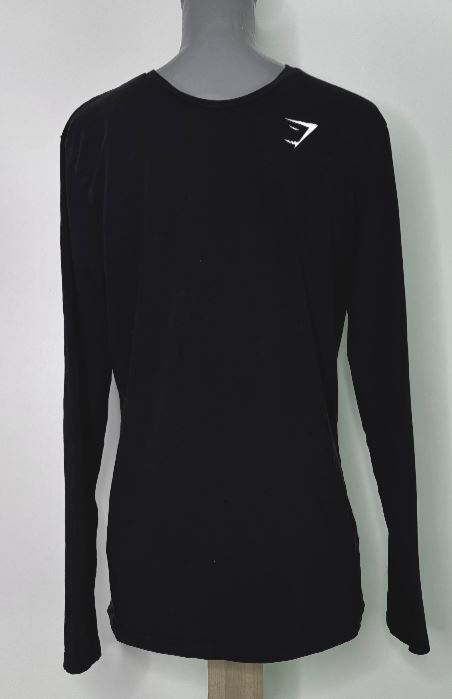 Black long-sleeve shirt with a logo on a mannequin against a white background