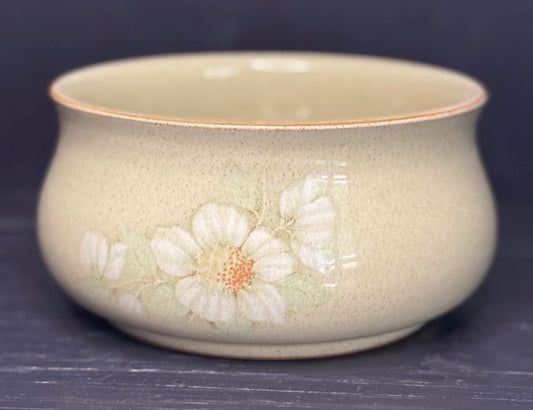 Ceramic bowl with floral design on a dark background
