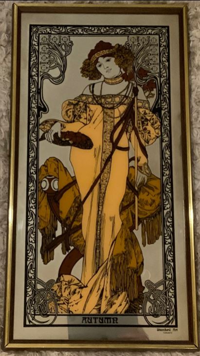 Decorative print of a woman with a horse, styled like Art Nouveau, framed in gold.