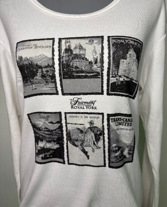 White tank top with black graphic designs and 'Fairmont Royal York' text.