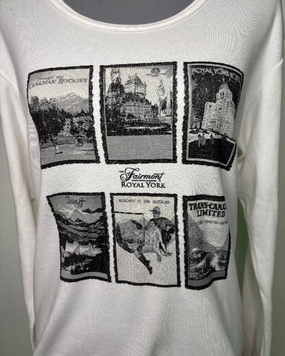 White tank top with black graphic designs and 'Fairmont Royal York' text.