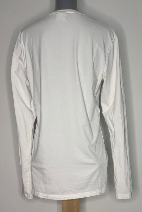 White long-sleeve shirt on a mannequin against a gray background