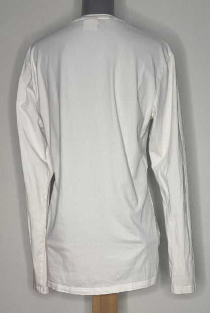 White long-sleeve shirt on a mannequin against a gray background
