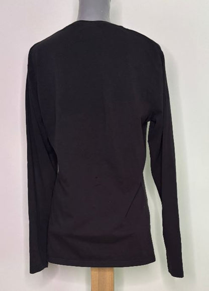 Black long-sleeve top on a mannequin against a white background