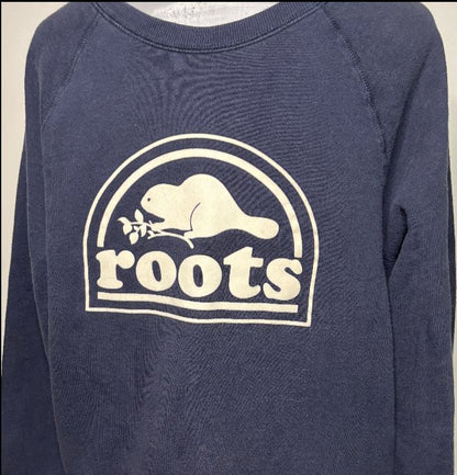Navy blue sweatshirt with 'roots' logo featuring a beaver on a beige background
