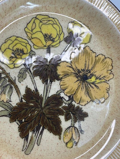 Decorative plate with floral design on a beige background