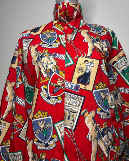 Red shirt with vintage-style graphics and logos on a gray background