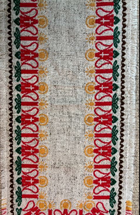 Textile with decorative border pattern on a neutral background