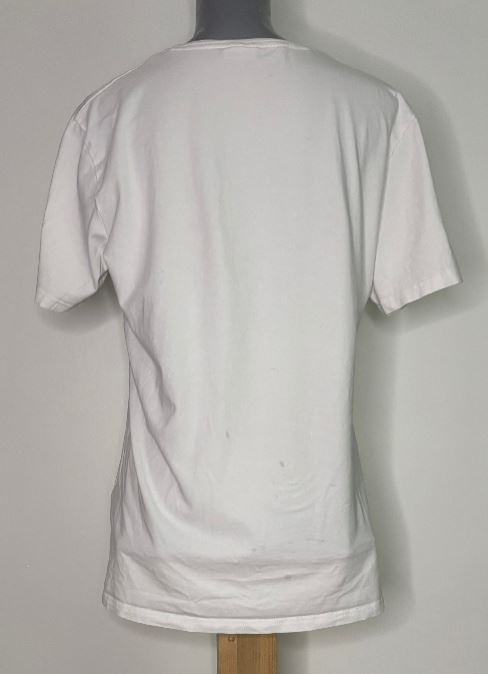 White t-shirt on a mannequin against a gray background