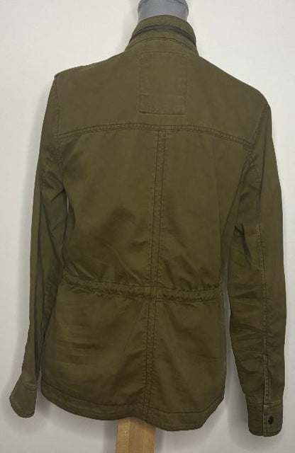 Green jacket on a mannequin against a white background