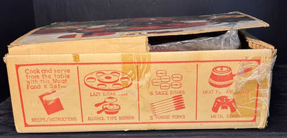 Cardboard box with illustrations and text on a black background