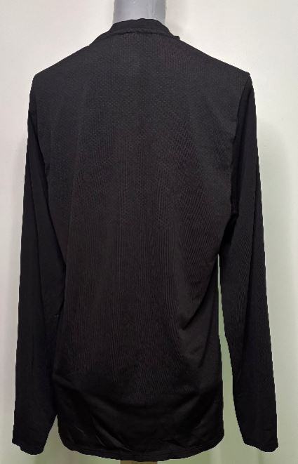 Black long-sleeve shirt on a mannequin against a white background