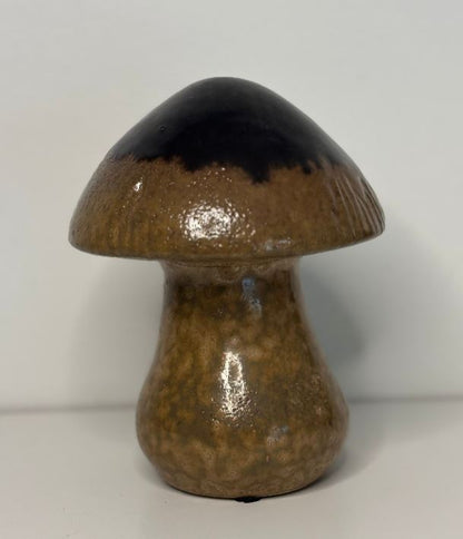 Ceramic mushroom with brown cap and body on a white background