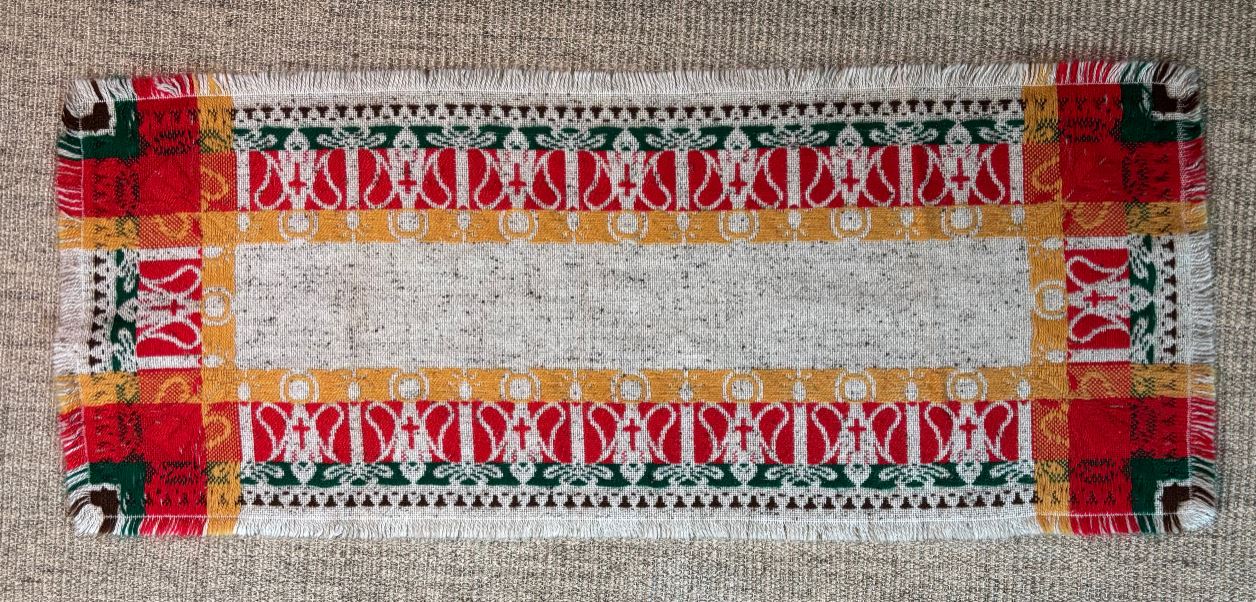 Decorative placemat with colorful patterns on a textured surface