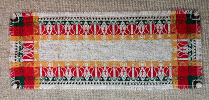 Decorative placemat with colorful patterns on a textured surface