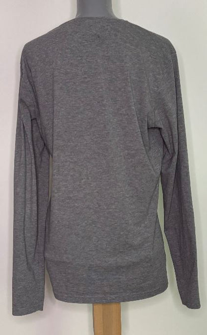 Gray long-sleeve shirt on a mannequin against a white background