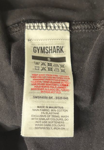 Gymshark label on a dark fabric background