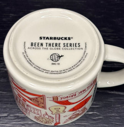 Starbucks mug with 'Been There Series' text on a dark background