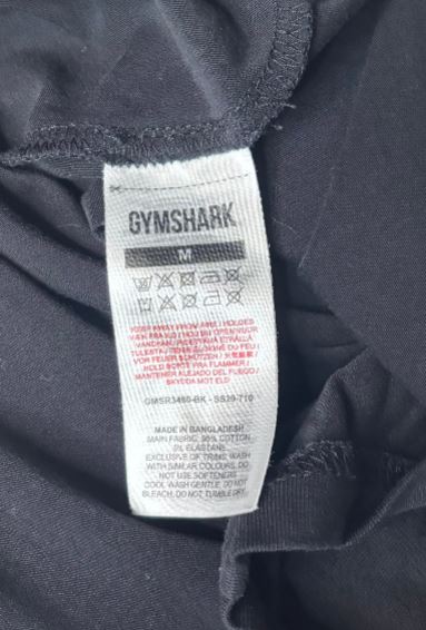 Gymshark label on a dark gray garment
