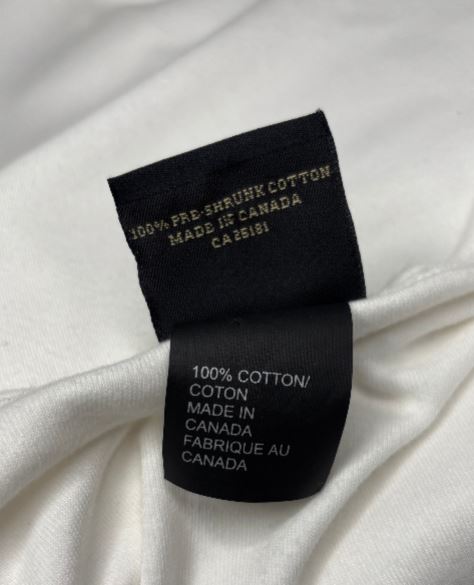 Clothing label on a white fabric background