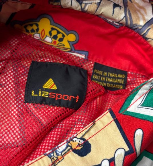 Close-up of a red sports jacket with a Lizsport label and cartoon character design.
