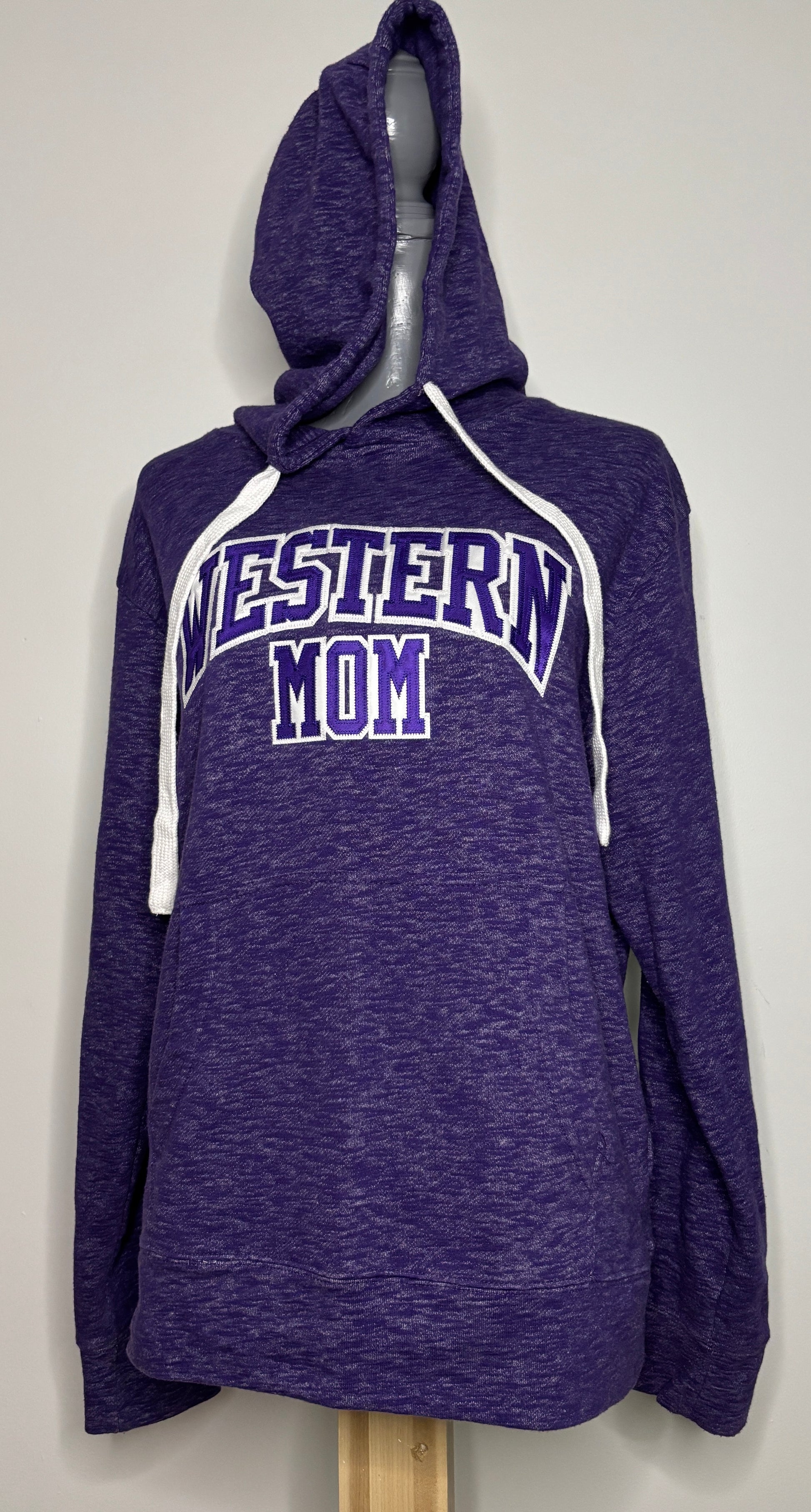 Purple hoodie with 'Western Mom' text on a mannequin against a gray background