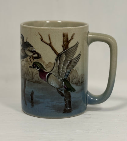 Mug with duck design on a plain background