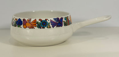 White ceramic pot with colorful bird and floral patterns on a white background