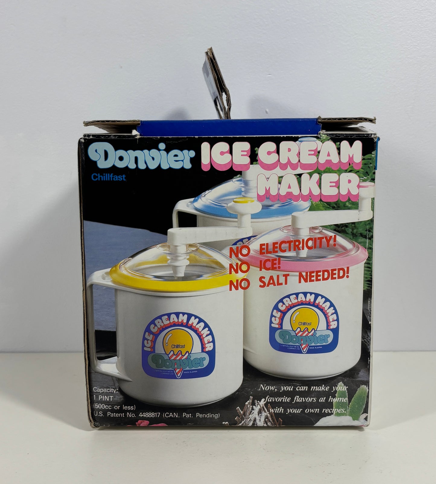 A boxed Dorsey Chillfast Ice Cream Maker shown in its retail packaging against a plain white wall and surface. The box features product photos of the ice cream maker with yellow and pink lids, and large text reading 'Dorsey ICE CREAM MAKER' and 'NO ELECTRICITY! NO ICE! NO SALT NEEDED!'.