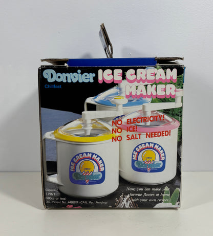 A boxed Dorsey Chillfast Ice Cream Maker shown in its retail packaging against a plain white wall and surface. The box features product photos of the ice cream maker with yellow and pink lids, and large text reading 'Dorsey ICE CREAM MAKER' and 'NO ELECTRICITY! NO ICE! NO SALT NEEDED!'.