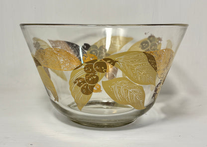 Clear glass bowl with gold leaf pattern on a white background