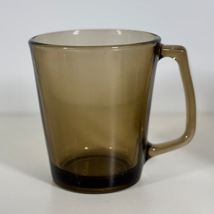 Brown glass mug on a white background