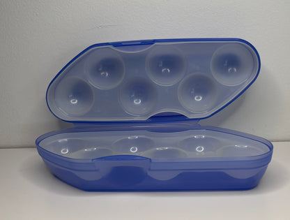 Blue plastic container with clear lid on a white background