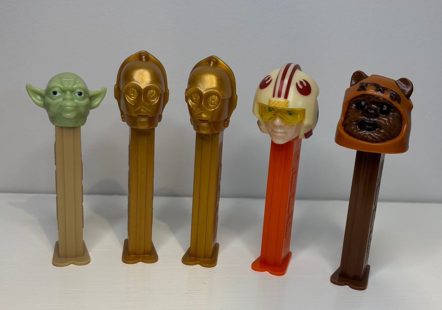 Set of Star Wars-themed PEZ dispensers on a white background