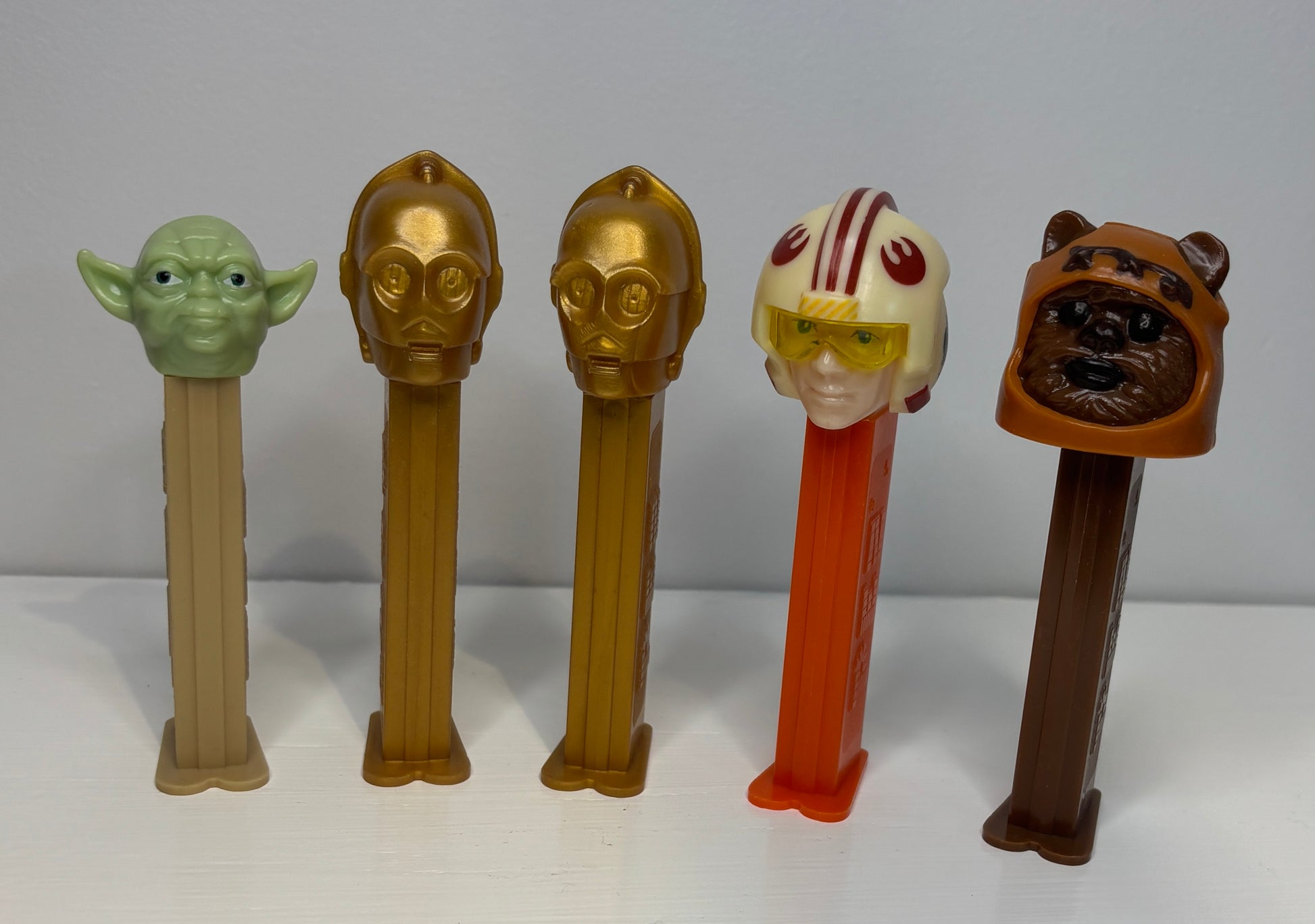 Set of Star Wars-themed PEZ dispensers on a white background