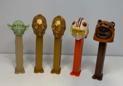 Set of Star Wars-themed PEZ dispensers on a white background