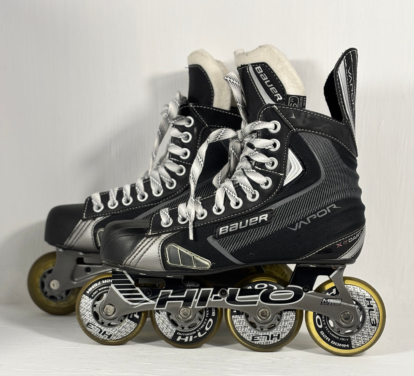 Pair of Bauer hockey skates on a white background