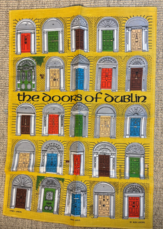 Poster of colorful doors on a yellow background with text 'the doors of dublin'.