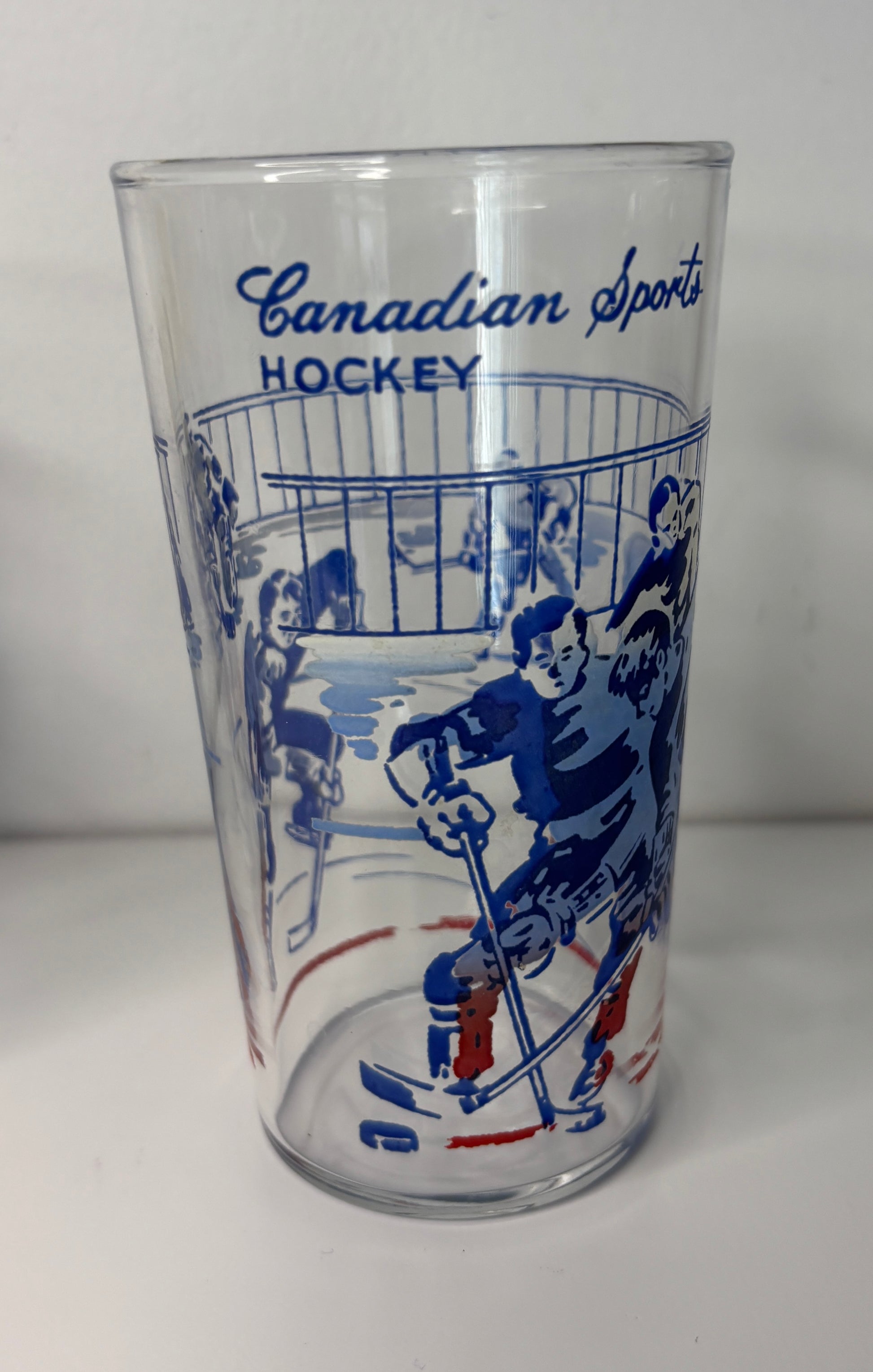 Clear glass with blue hockey-themed illustration and 'Canadian Sports Hockey' text on a white background