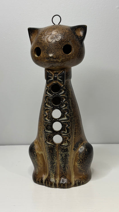 Ceramic cat-shaped incense burner with decorative patterns on a white background