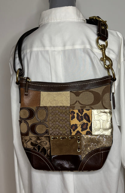 Patchwork patterned handbag on a mannequin with a white shirt background
