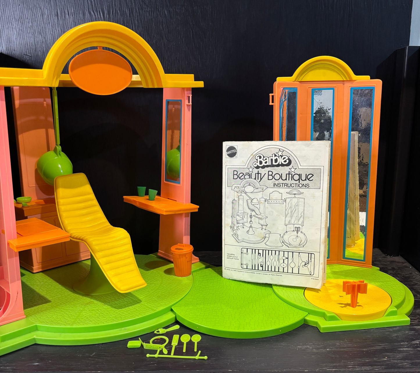 Barbie Beauty Boutique playset with accessories on a dark background