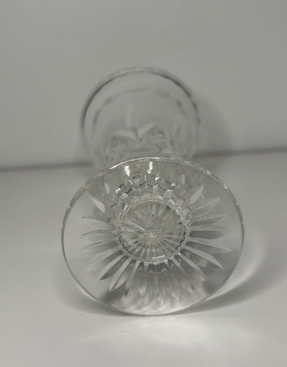 Clear glass with intricate design on a light gray background